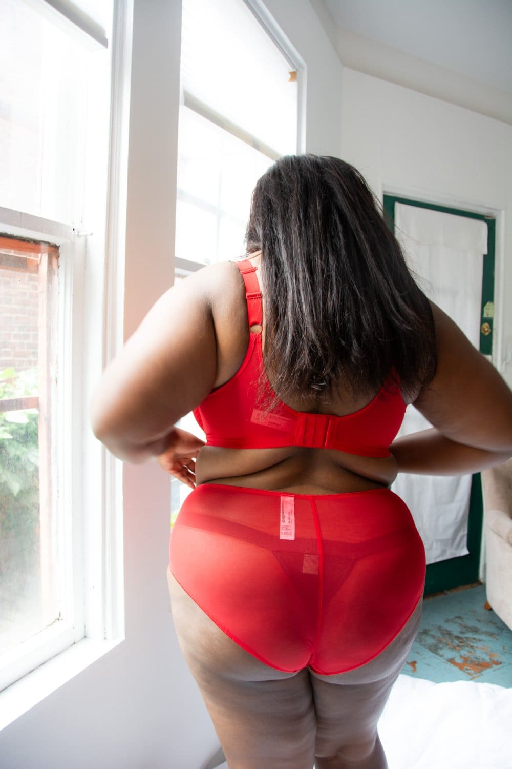 Elomi matilda plunge bra in haute red, back view on a model, close-up.