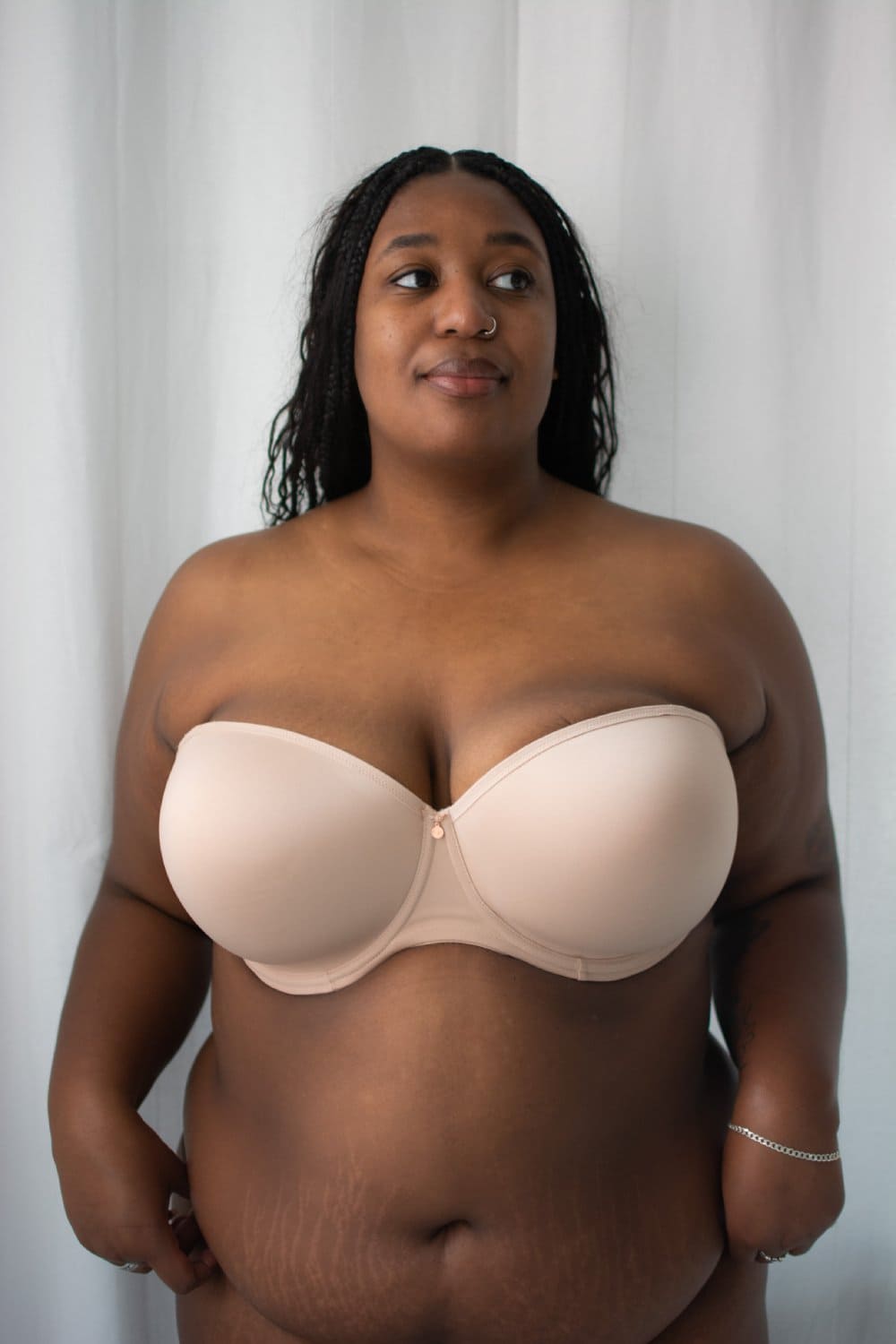 Elomi smooth underwire moulded strapless bra in sahara beige on a model front view.