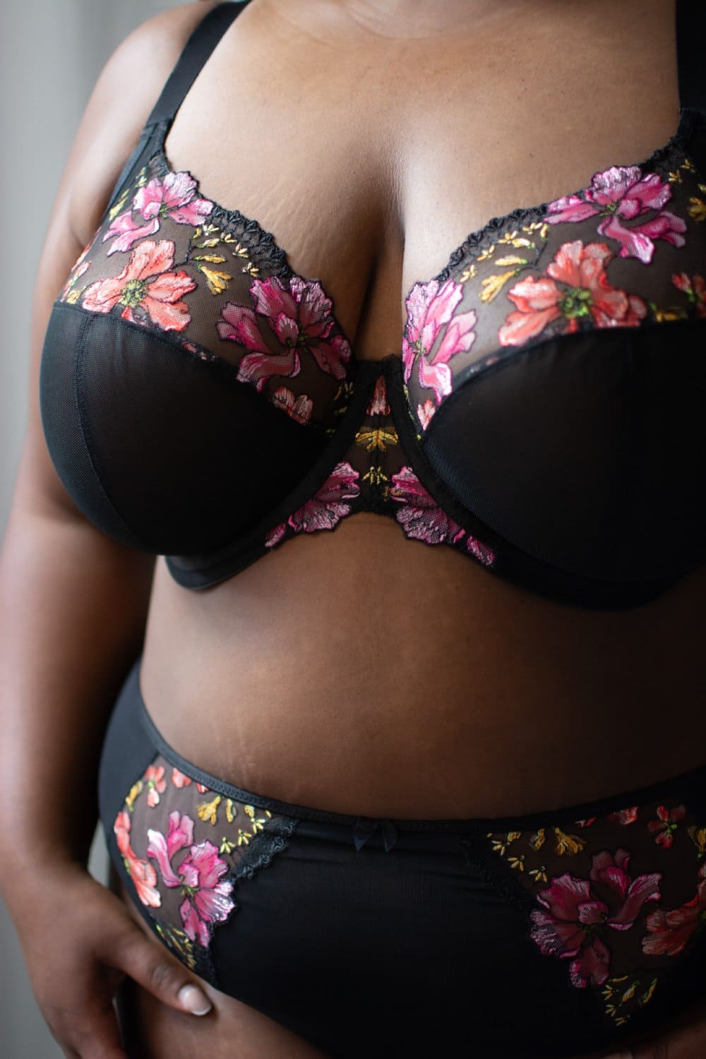 Elomi teagan plunge bra in rainbow, front view on a model, close-up, detailed shot, tight crop.