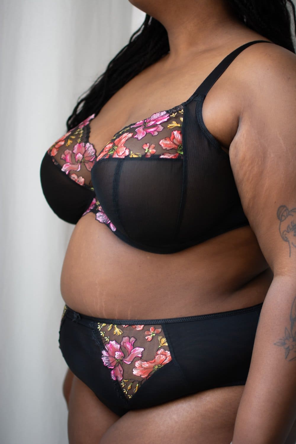 Elomi teagan plunge bra in rainbow, side view on a model, close-up.