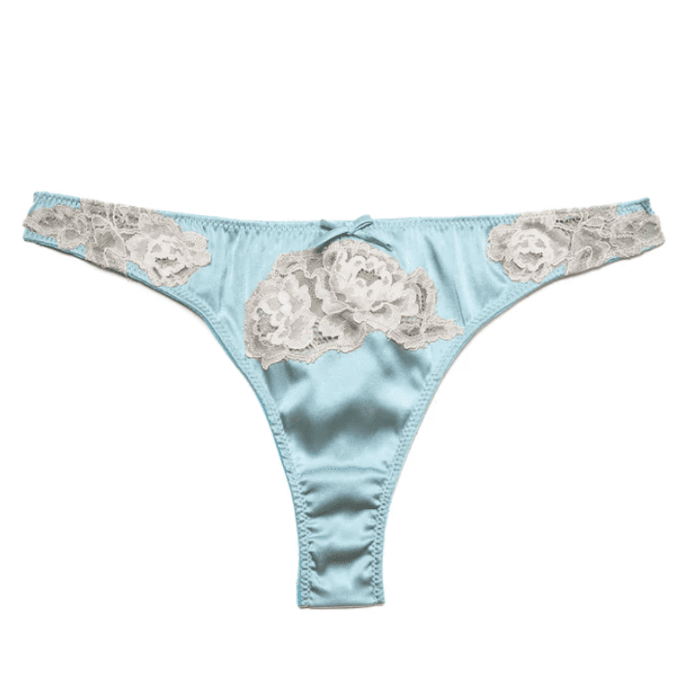 Fleur du mal juliet lace thong in frosted mint, close-up on white background.