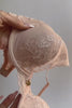 Natori Cherry Blossom convertible bra in cameo rose, close-up video showing fabric stretch.