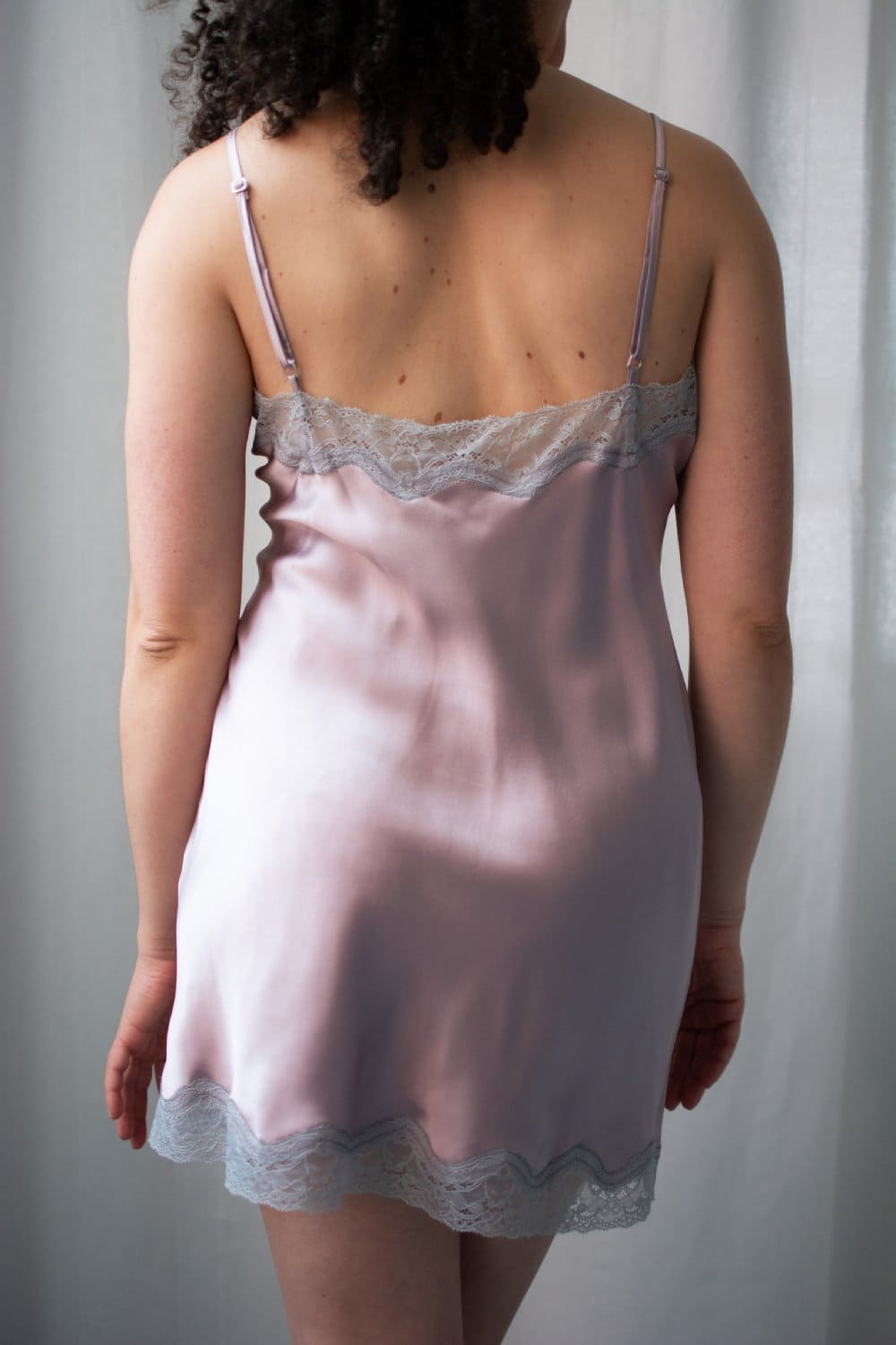 Samantha chang classic silk babydoll in dusk and silver lace, back view on a model, close-up.