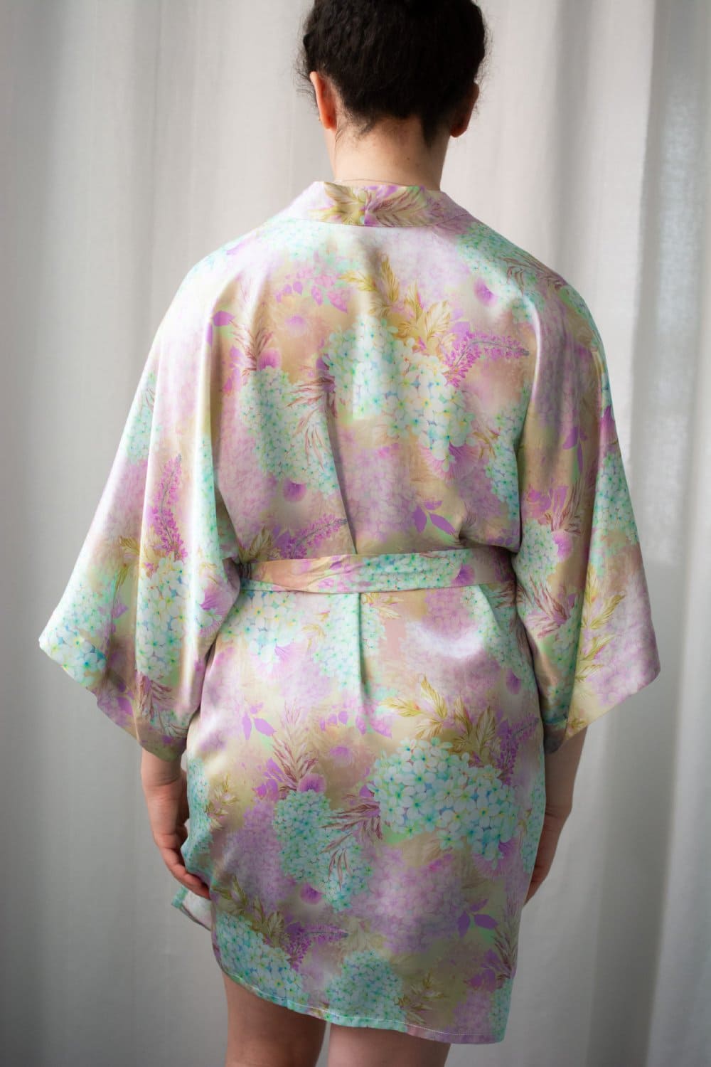 Samantha chang classic silk short kimono in forget me not, back view on a model, close-up.